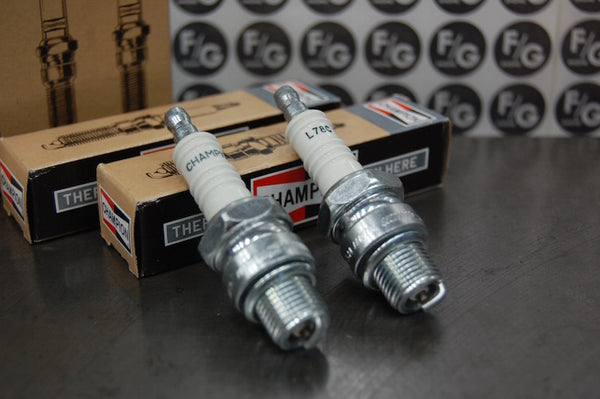Photo of a pair of Champion L78C spark plugs used in vintage Triumph motorcycles