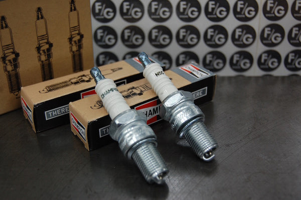 Photo of a pair of Champion N5C spark plugs used in vintage Triumph motorcycles 